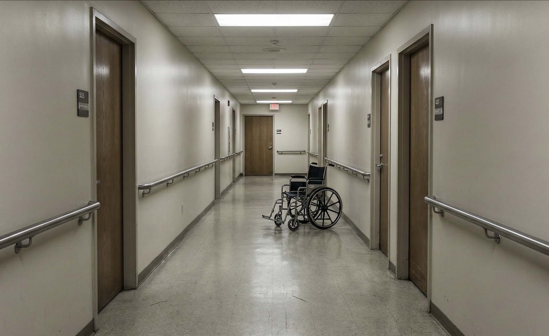 Empty nursing home hallway with an unattended wheelchair, illustrating the staffing shortage crisis in U.S. care facilities